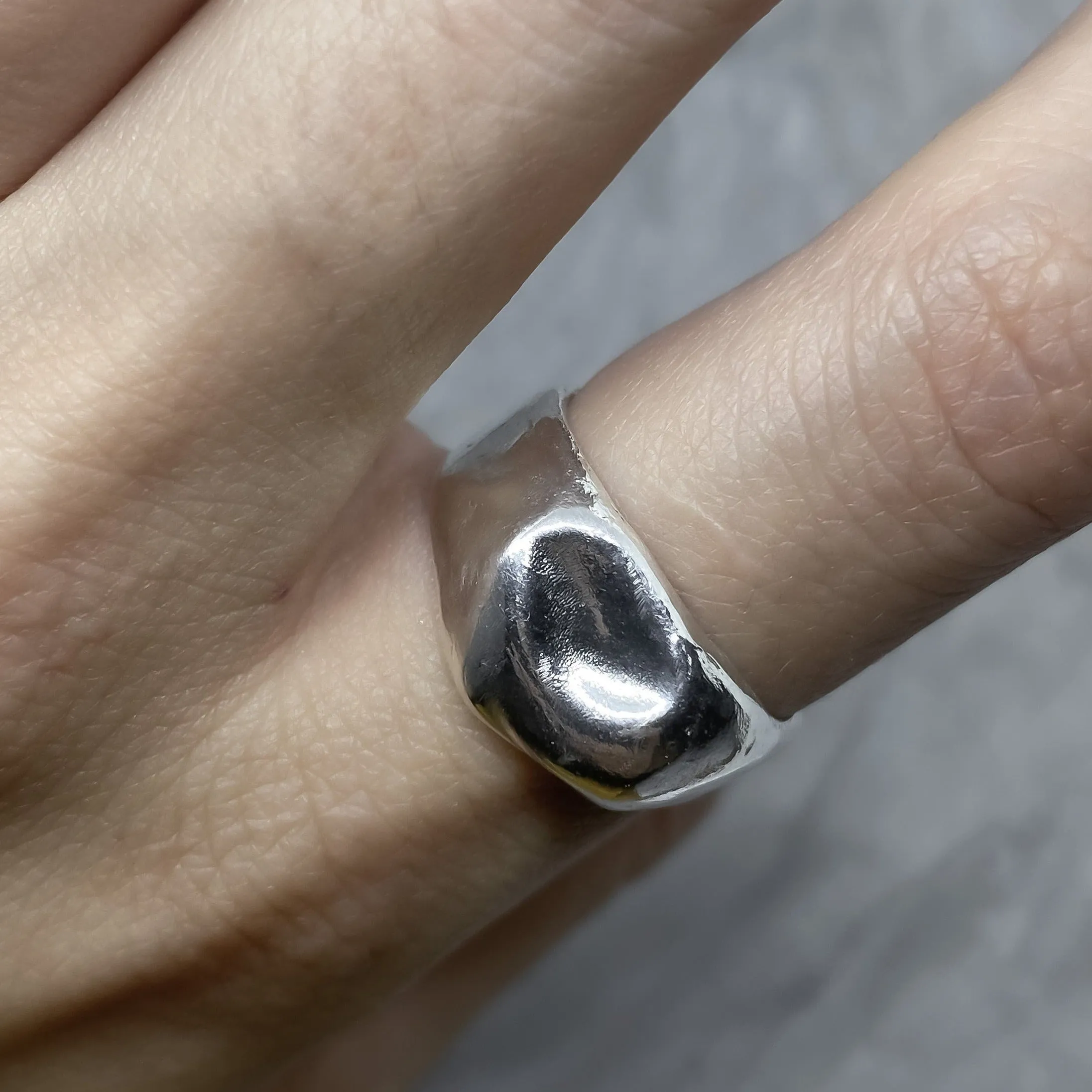 Liquid ring- a wide band of silver resembles liquid metal